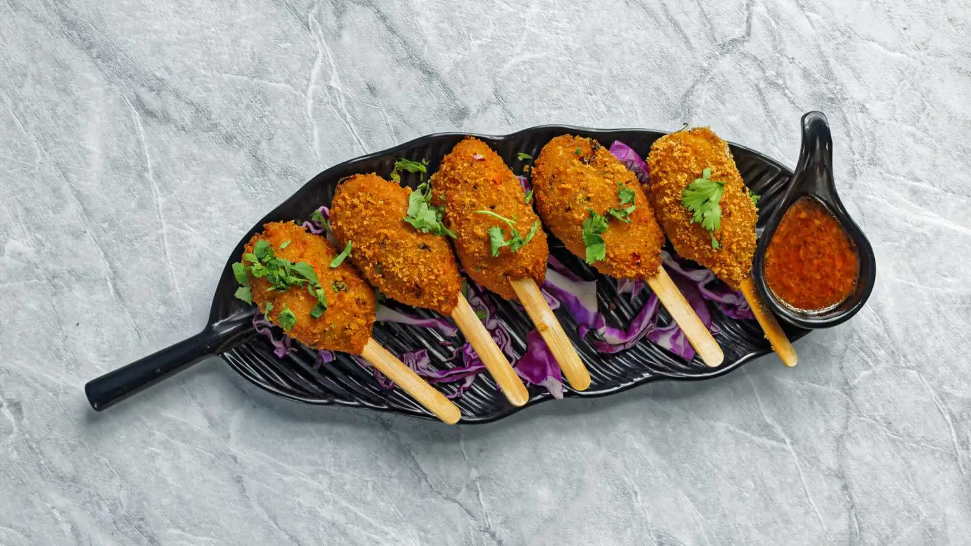 Veg Lollipop $7.99 - Vegetarian Indo-Chinese Appetizer at Desi Club Indian Street Food Edmonton - Deep-fried vegetable balls with spicy sauce