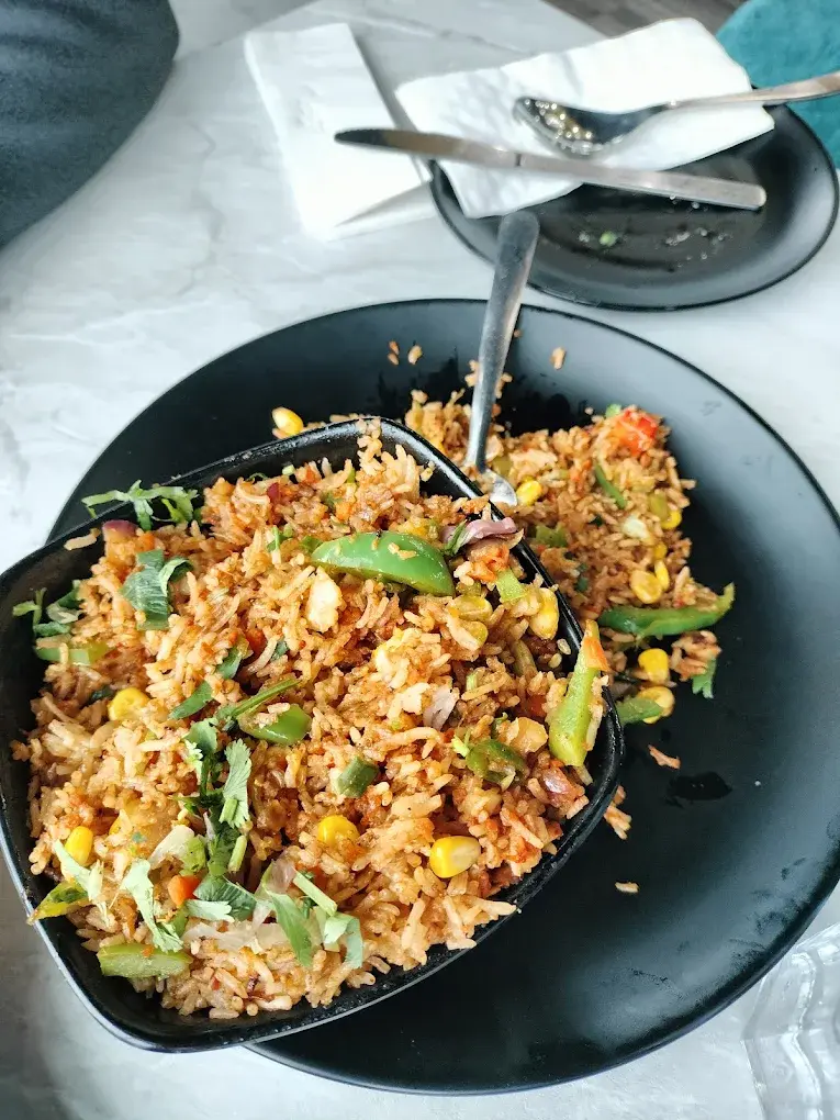 Pao Bhaji - Mumbai Street Food at Desi Club Edmonton - Thick mixed vegetable curry served with soft buttered bread rolls and aromatic spices
