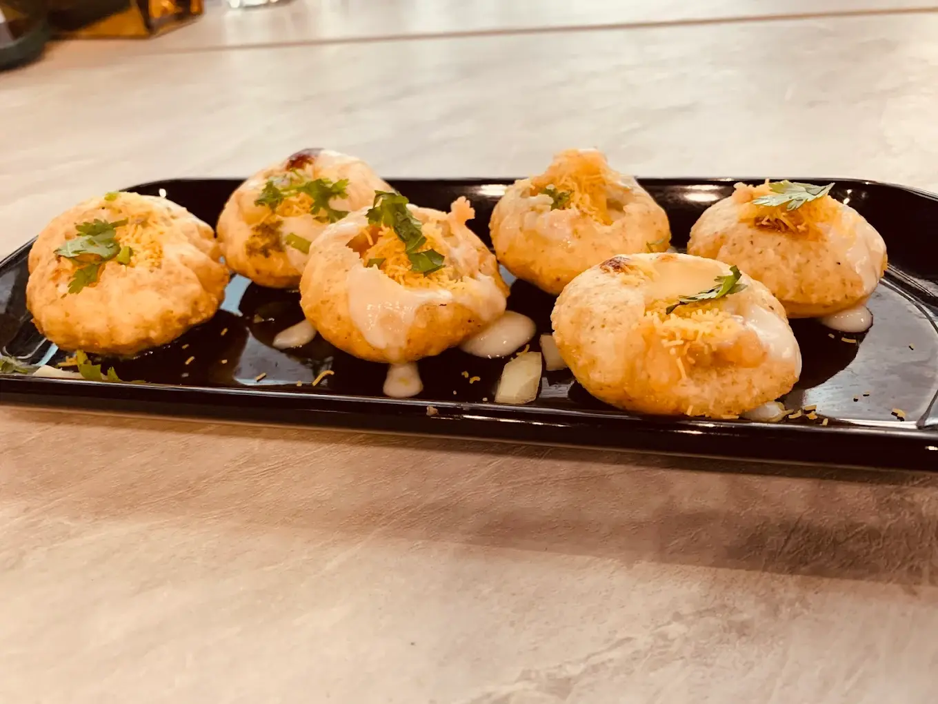 Steamed Veg Momos - Hand-made Dumplings at Desi Club Edmonton - Savory vegetable-filled dumplings steamed and served with spicy dipping sauce
